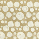 Pattern of cream circles on a tan background