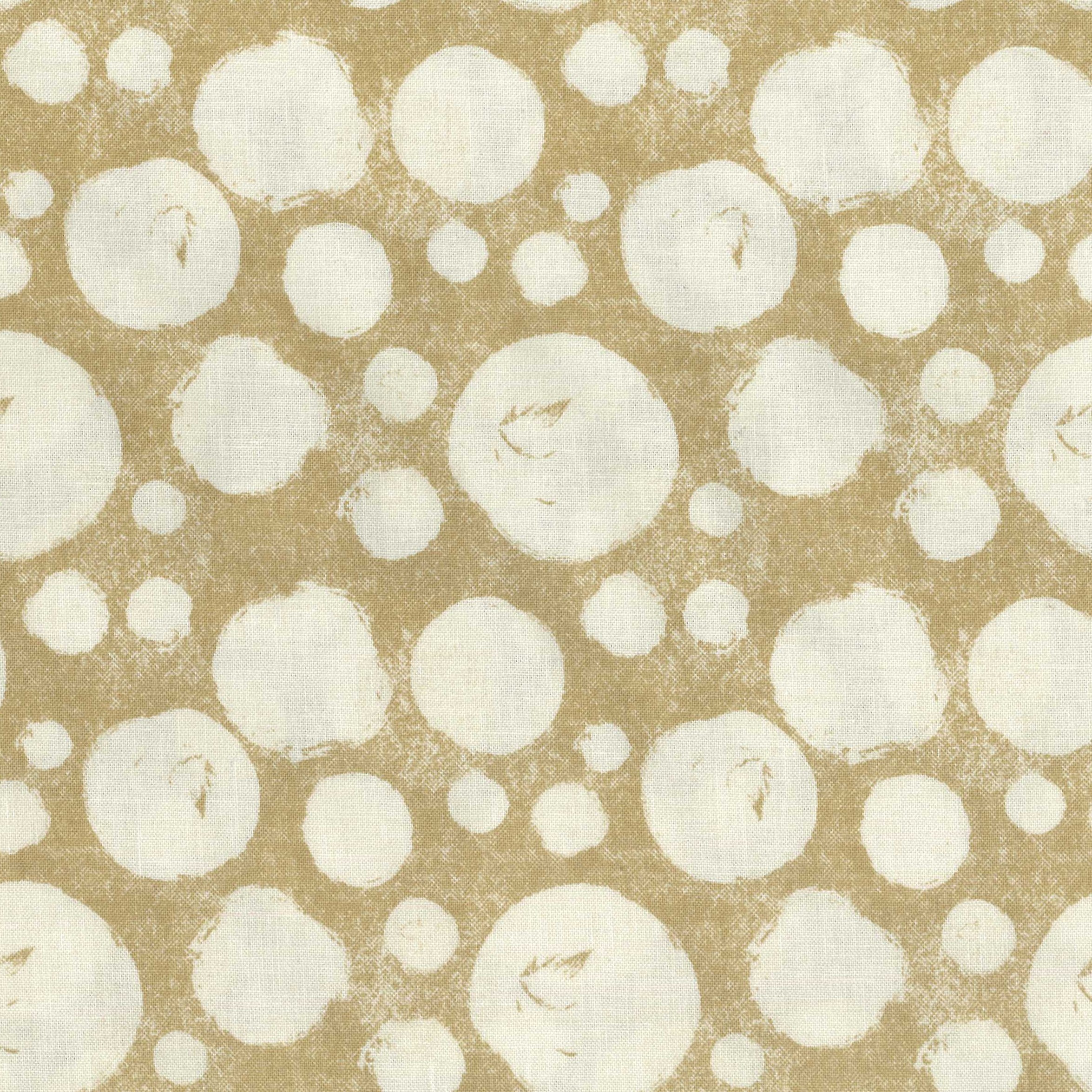 Pattern of cream circles on a tan background