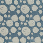 Pattern of cream circles on a blue background