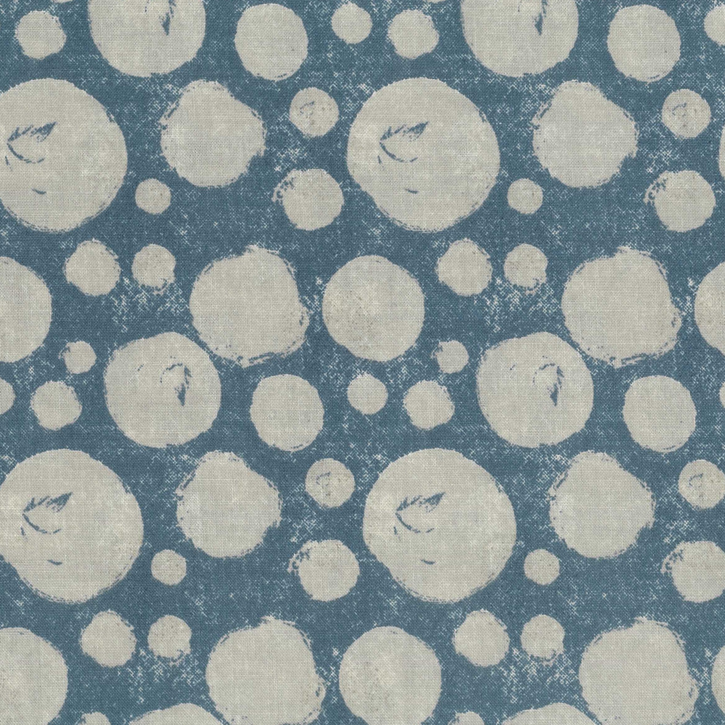 Pattern of cream circles on a blue background