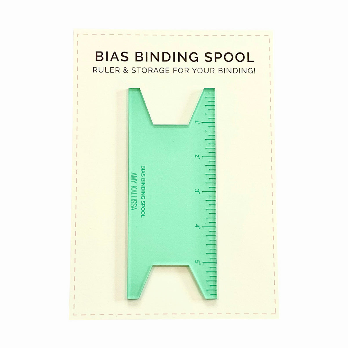 Green bias binding spool ruler on a white background