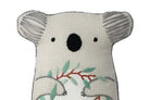 Stuffed koala toy with leaf design on a white background