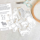 Set of dog-themed embroidery patterns with scissors and a hoop on a light background