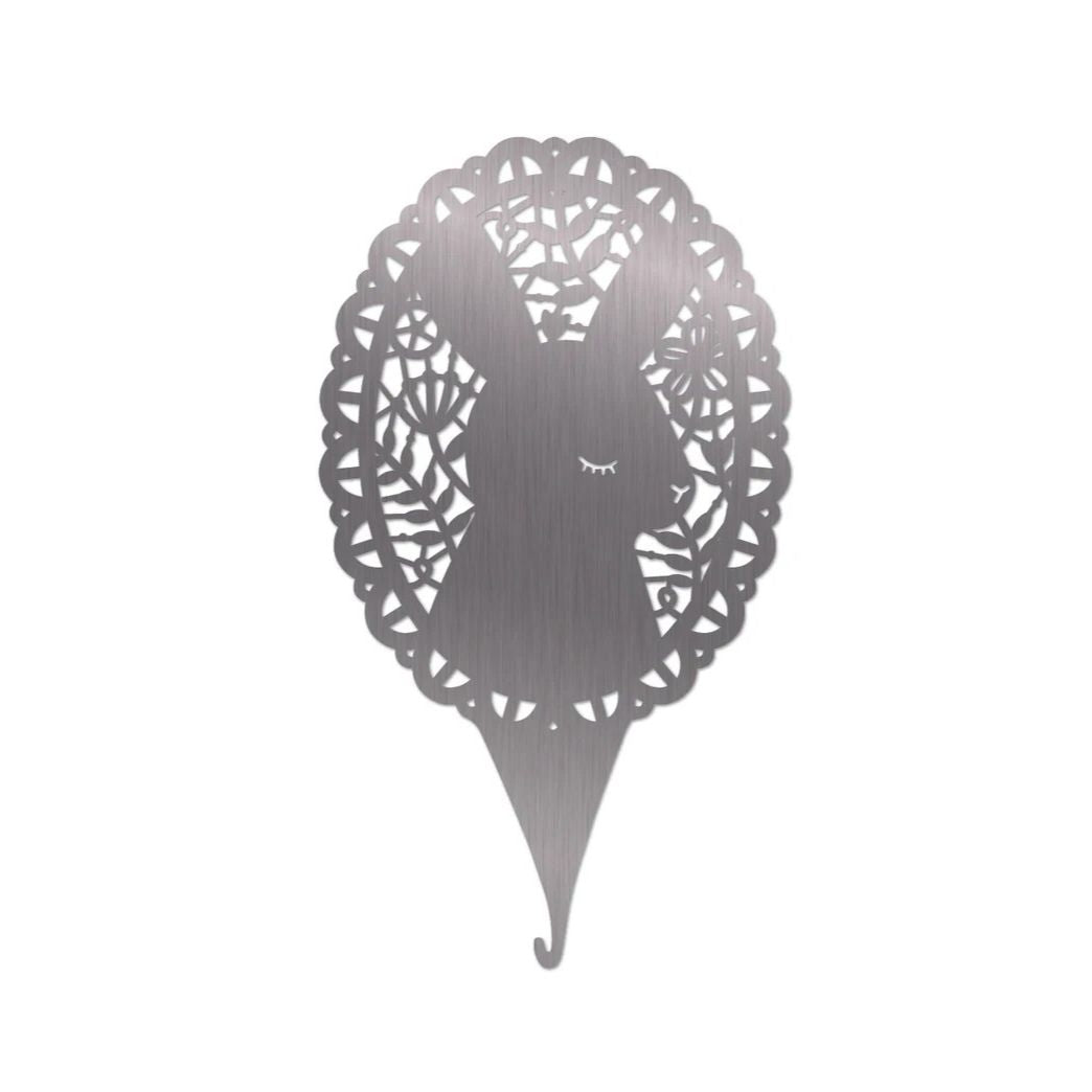 Decorative needle threader with a bunny in a floral lace design on a white background